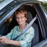 19 Car Aids For Seniors That Make Driving More Comfortable (and Safer) an older woman driving
