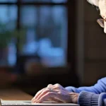 elderly woman on her laptop