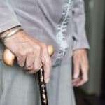 Senior Mobility: Quad vs Regular Cane Comparison woman with cane