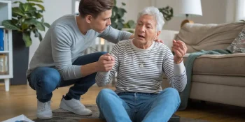 helping an older adult up off the floor