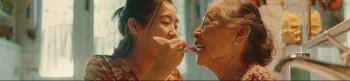 helping senior brush teeth