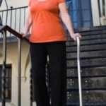 Senior Walking Aid: Who Uses Quad Canes? lady using a quad cane