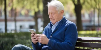 senior man using password manager